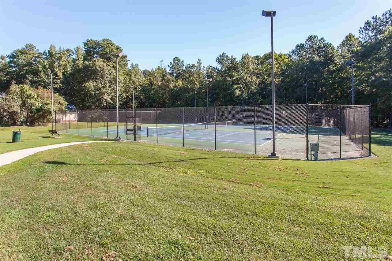 2156 Persimmon Ridge Drive Raleigh, NC 27604 - Photo 22 of 23 Tennis Court accessed by fob. Pickleball courts also outlined on the courts and a team plays indoors weekly.