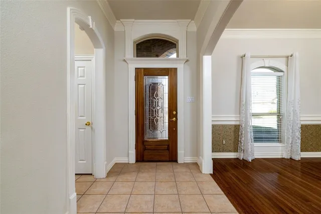 a view of a livingroom with wooden floor and a fireplace