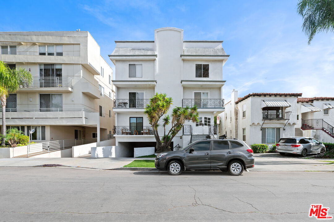 1206 South Holt Avenue, Unit 2 Los Angeles, CA 90035 - Photo 1 of 17 a car parked in front of a building