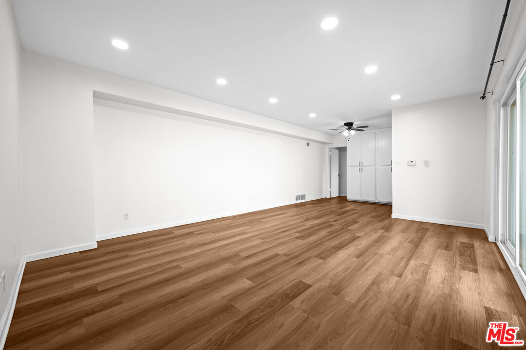 1206 South Holt Avenue, Unit 2 Los Angeles, CA 90035 - Photo 2 of 17 a view of empty room with wooden floor