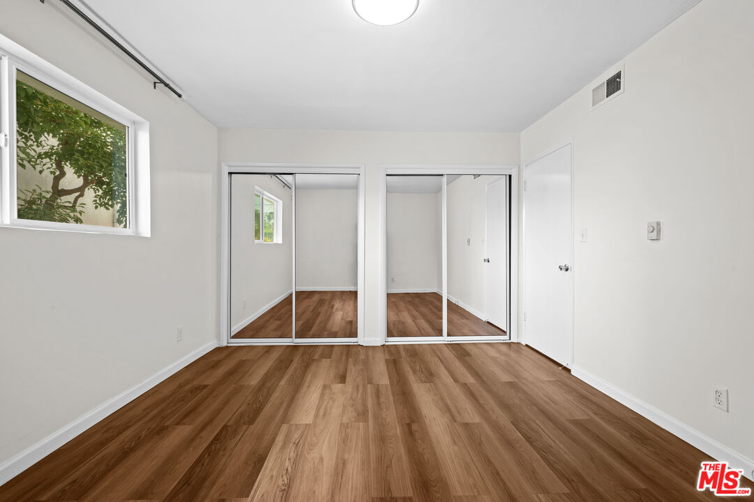 1206 South Holt Avenue, Unit 2 Los Angeles, CA 90035 - Photo 9 of 17 a view of wooden floor in a room