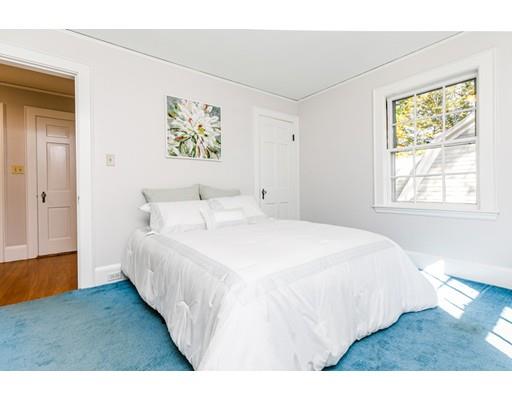 31 Locust Avenue Lexington, MA 02421 - Photo 15 of 30 a bedroom with a bed and a painting on the wall