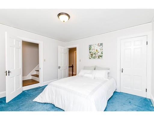 31 Locust Avenue Lexington, MA 02421 - Photo 16 of 30 a bedroom with a bed and a painting on the wall