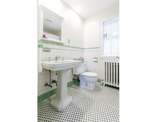 31 Locust Avenue Lexington, MA 02421 - Photo 24 of 30 a bathroom with a sink toilet a mirror and shower