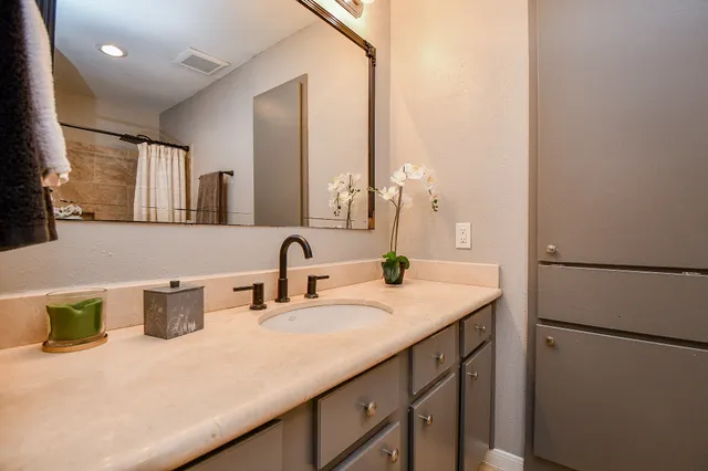 a bathroom with a sink and a mirror