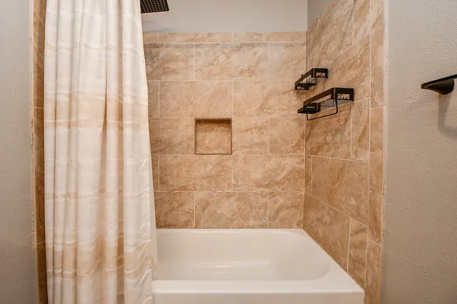 a bathroom with a bathtub