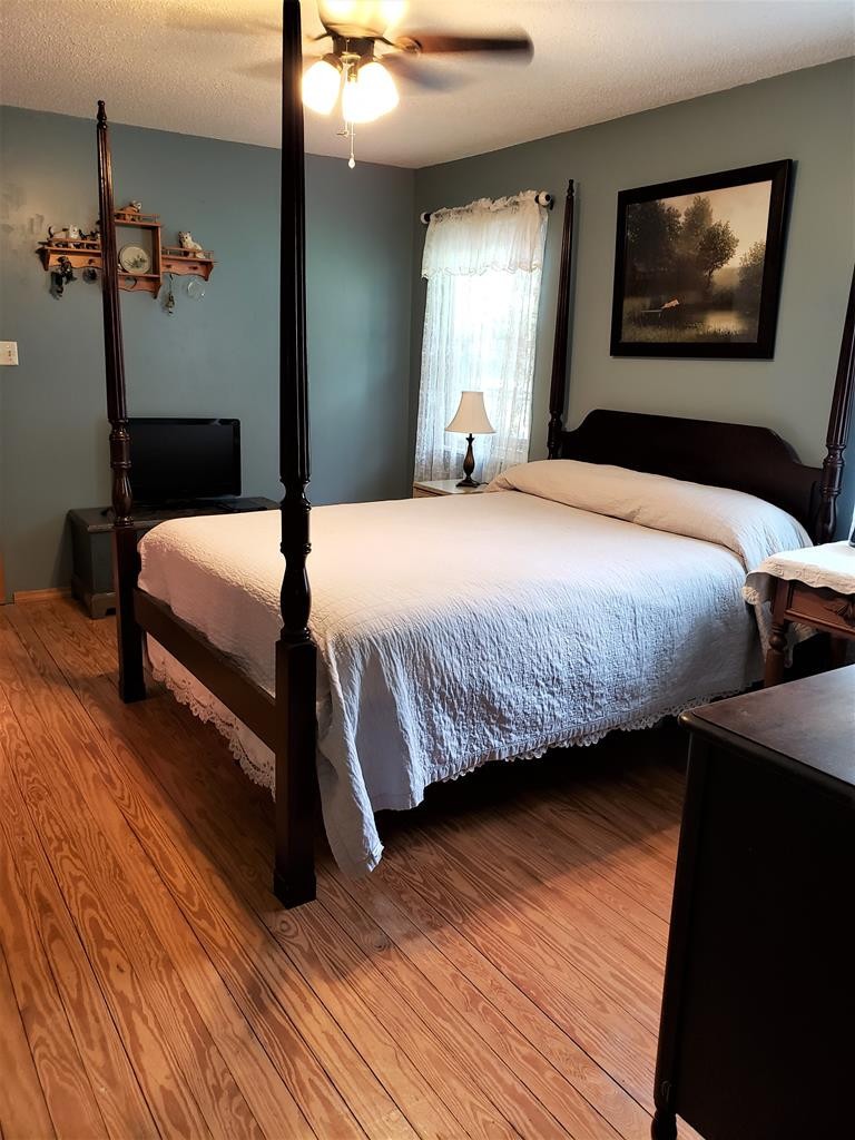 375 Todd Road Southeast Cleveland, TN 37323 - Photo 19 of 47 a bedroom with bed and wooden floor
