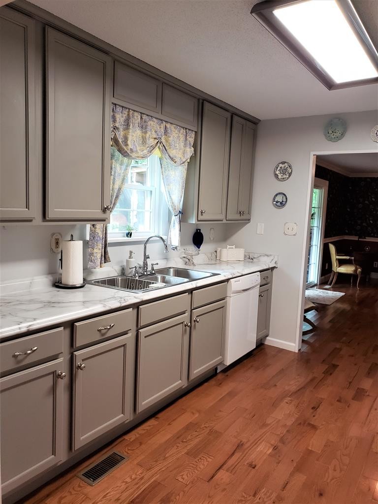 375 Todd Road Southeast Cleveland, TN 37323 - Photo 10 of 47 a kitchen with a sink window and cabinets