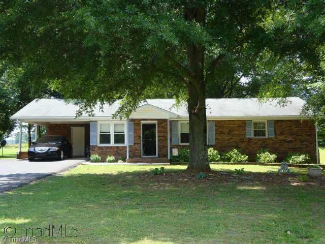 121 Pete Foster Road Mocksville, NC 27028 - Photo 1 of 9 Exterior Front. Brick Ranch with Attached Carport, 3 Bedrooms 1.5 Baths, 1.63 acre lot.. Huge Yard extends over to row of trees (look for stakes on your right), Great garden area