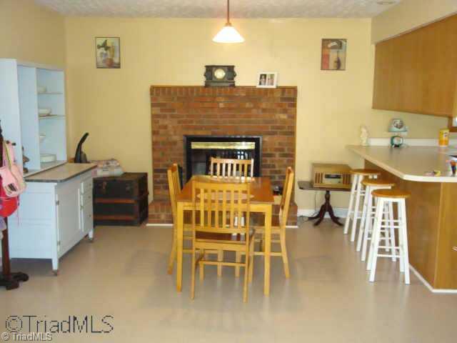 121 Pete Foster Road Mocksville, NC 27028 - Photo 3 of 9 Other. Dining area with Wood Fireplace
