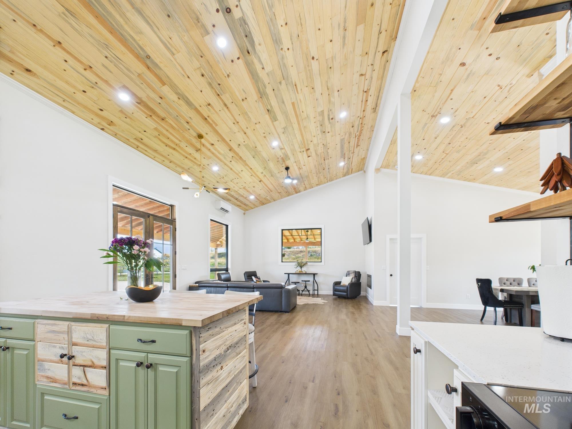 6501 Sweet Ola Highway Sweet, ID 83670 - Photo 11 of 43 Kitchen featuring green cabinets, wooden counters, a wood ceiling with exposed beams, healthy amount of natural light, and light wood-style floors