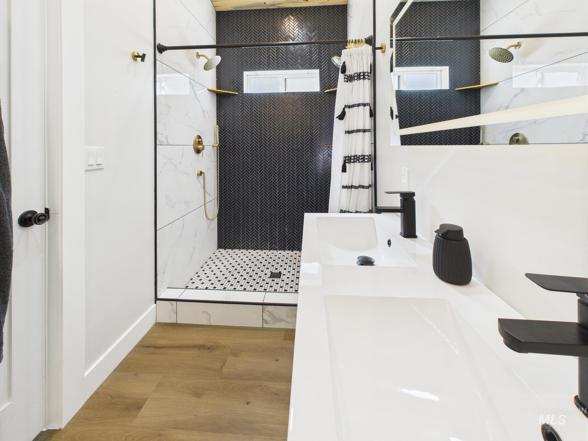 6501 Sweet Ola Highway Sweet, ID 83670 - Photo 20 of 43 Bathroom featuring a walk in shower, wood finished floors, and double vanity