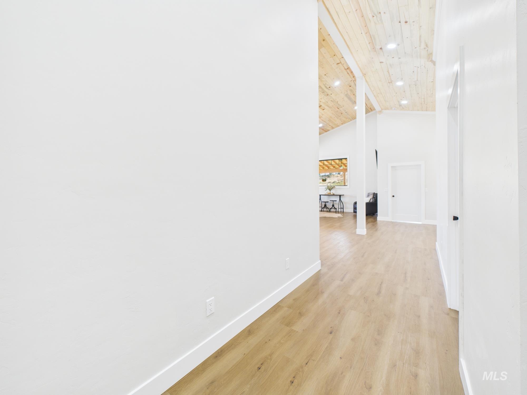 6501 Sweet Ola Highway Sweet, ID 83670 - Photo 21 of 43 Hall featuring light wood-style flooring, a wooden ceiling with exposed beams, and high vaulted ceiling