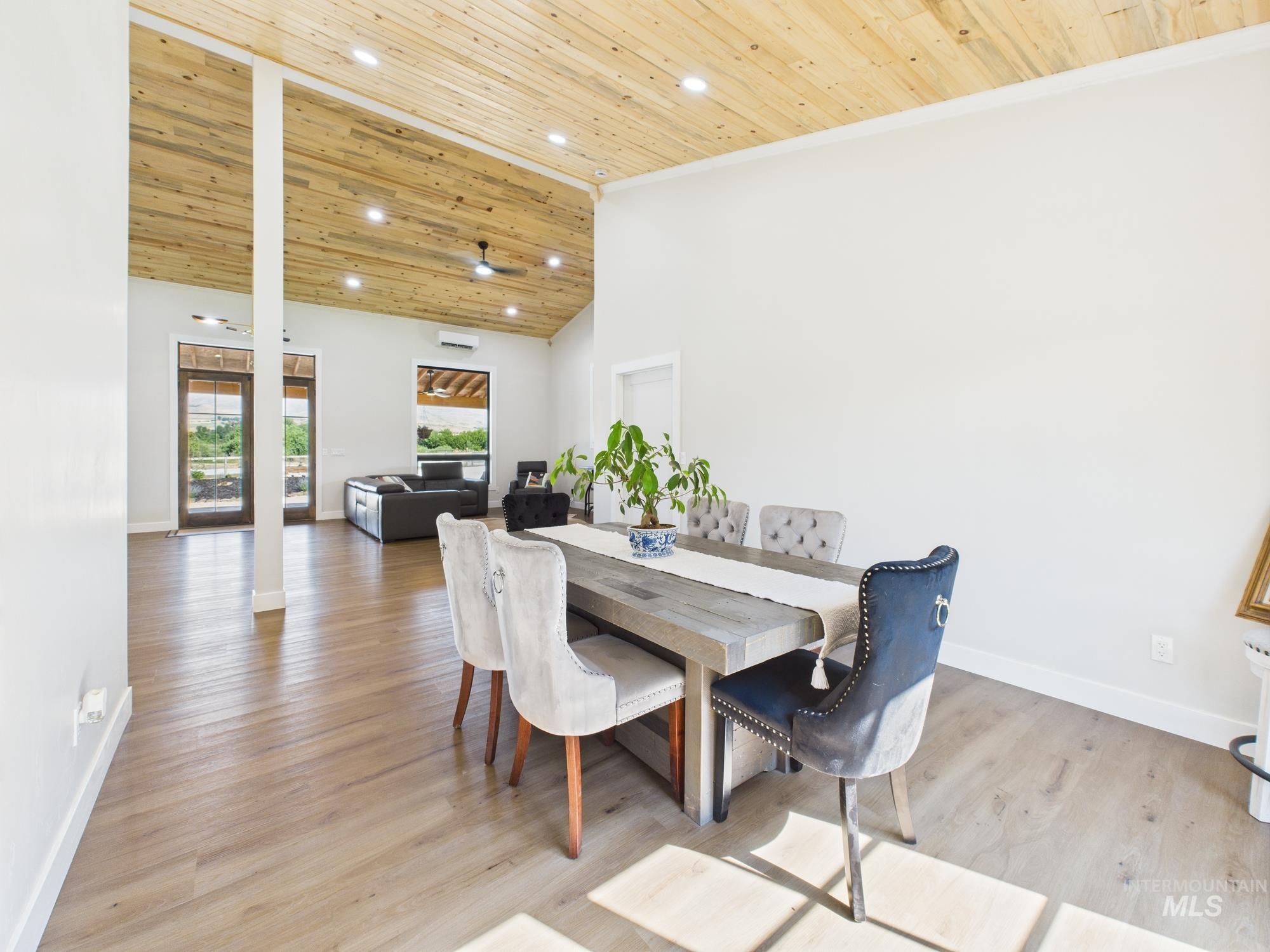 6501 Sweet Ola Highway Sweet, ID 83670 - Photo 26 of 43 Dining room with wooden ceiling, light wood finished floors, high vaulted ceiling, crown molding, and recessed lighting
