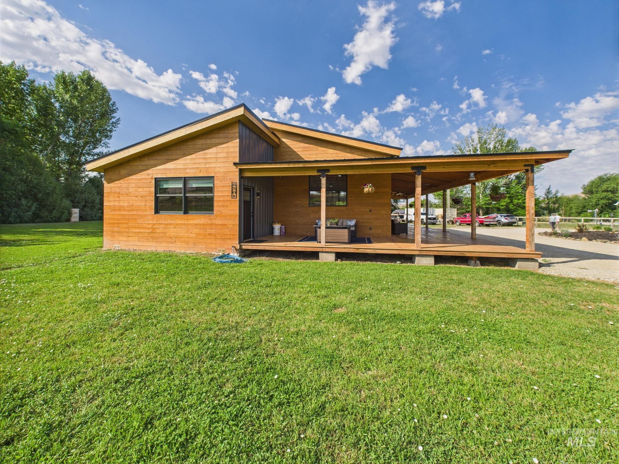 6501 Sweet Ola Highway Sweet, ID 83670 - Photo 33 of 43 Rear view of house with a lawn
