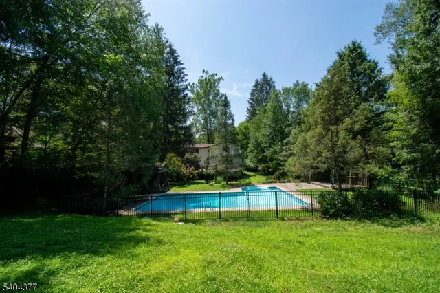 a backyard with a table and chairs