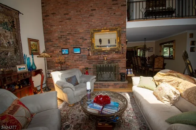 a living room with furniture fireplace and flat screen tv