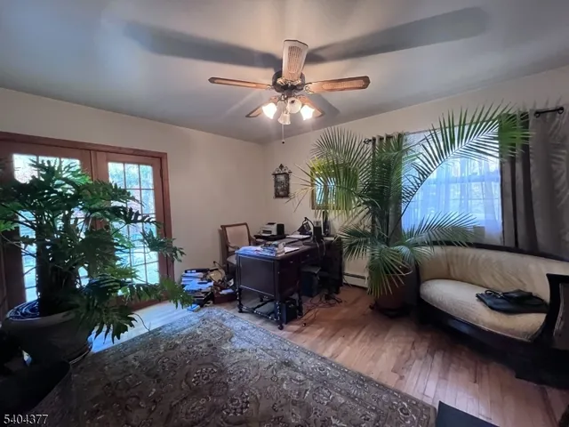 a bedroom with a bed and a lamp