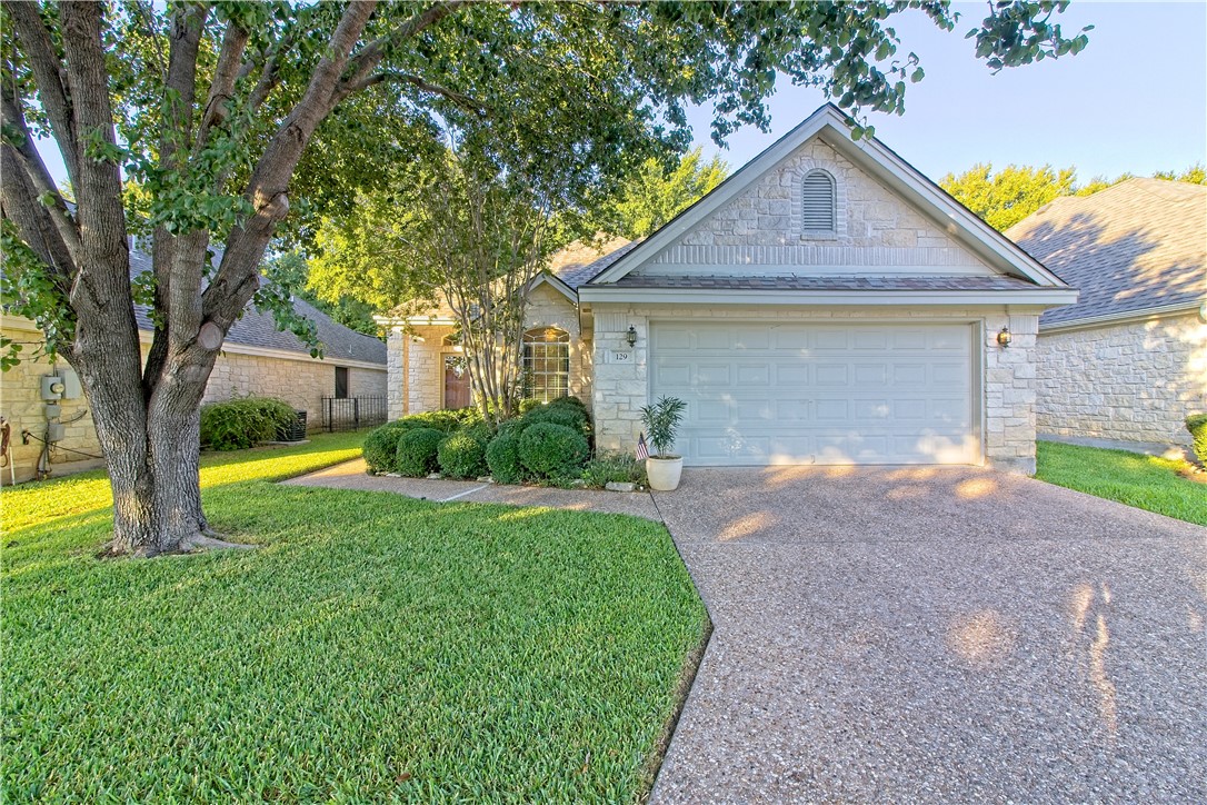 129 Melissa Court Georgetown, TX 78628 - Photo 1 of 1 a front view of a house with garden