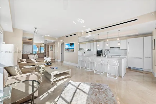 a kitchen with stainless steel appliances kitchen island granite countertop a sink and cabinets