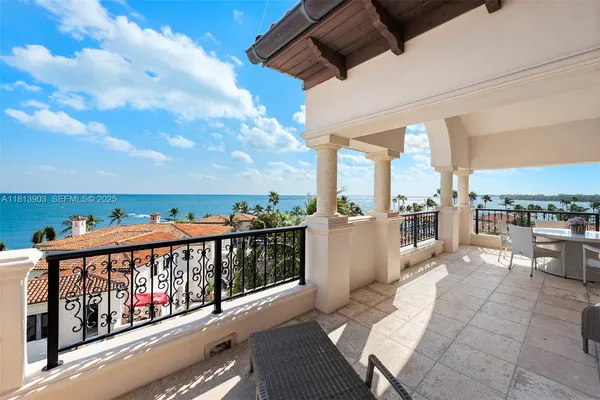 a view of a balcony with wooden floor