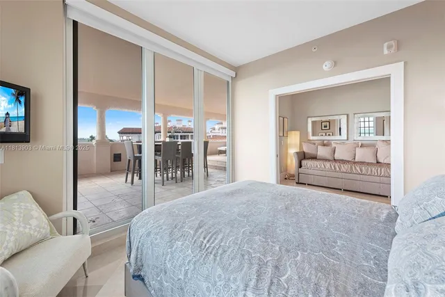 a spacious bathroom with a granite countertop sink a toilet and a mirror