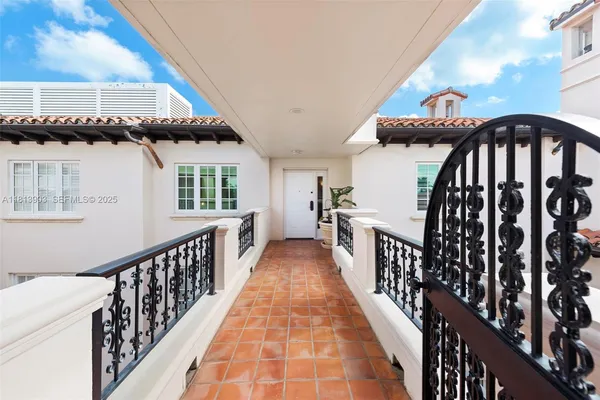 a front view of multiple houses with yard