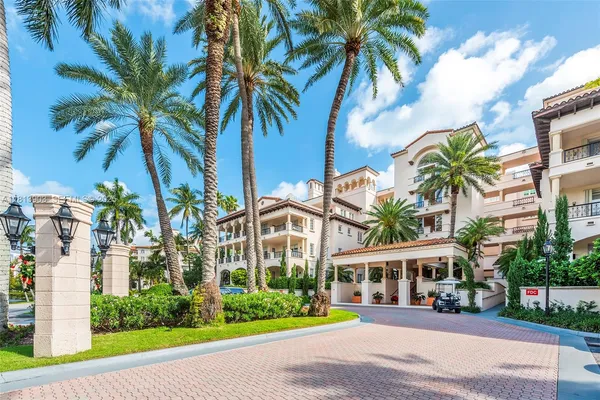 a view of a patio with table and chairs under an umbrella