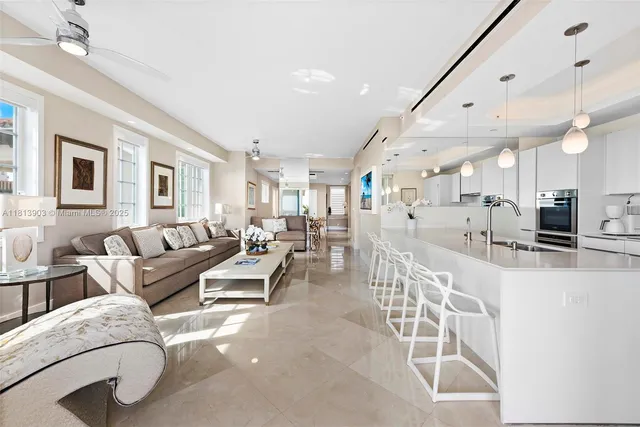 a kitchen with stainless steel appliances kitchen island granite countertop a sink and cabinets