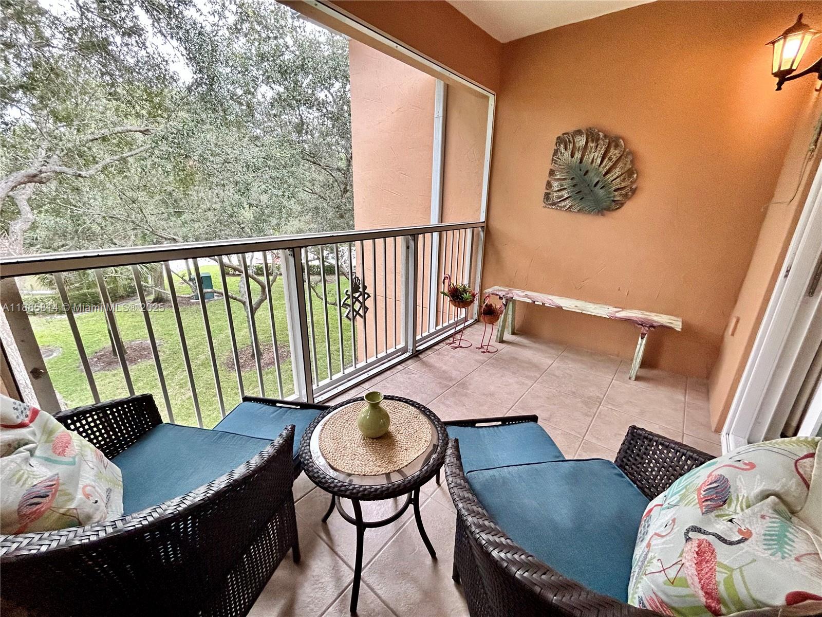 5080 Fairways Circle, Unit 307 Vero Beach, FL 32967 - Photo 11 of 27 a living room with furniture and a rug