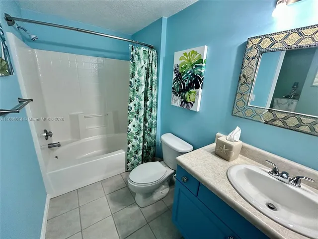 a view of a house with pool and chairs