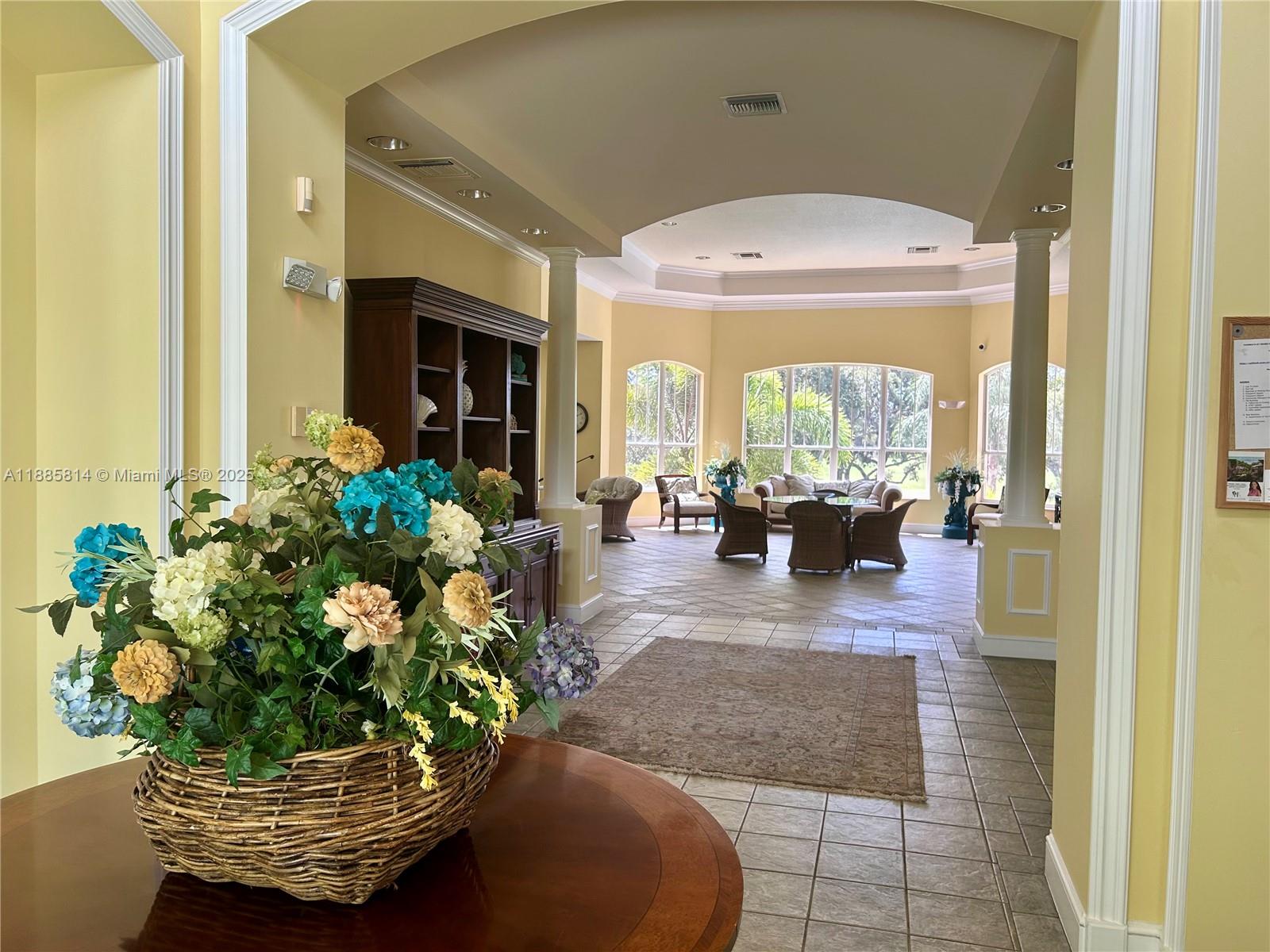 5080 Fairways Circle, Unit 307 Vero Beach, FL 32967 - Photo 22 of 27 a living room with furniture and a potted plant