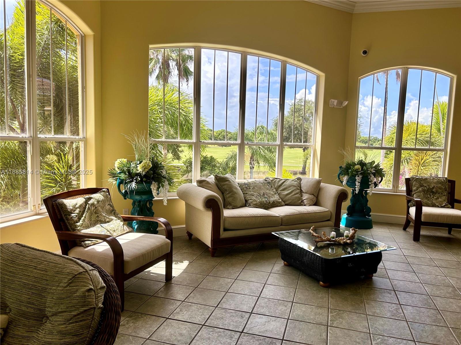 5080 Fairways Circle, Unit 307 Vero Beach, FL 32967 - Photo 23 of 27 a living room with furniture and a large window