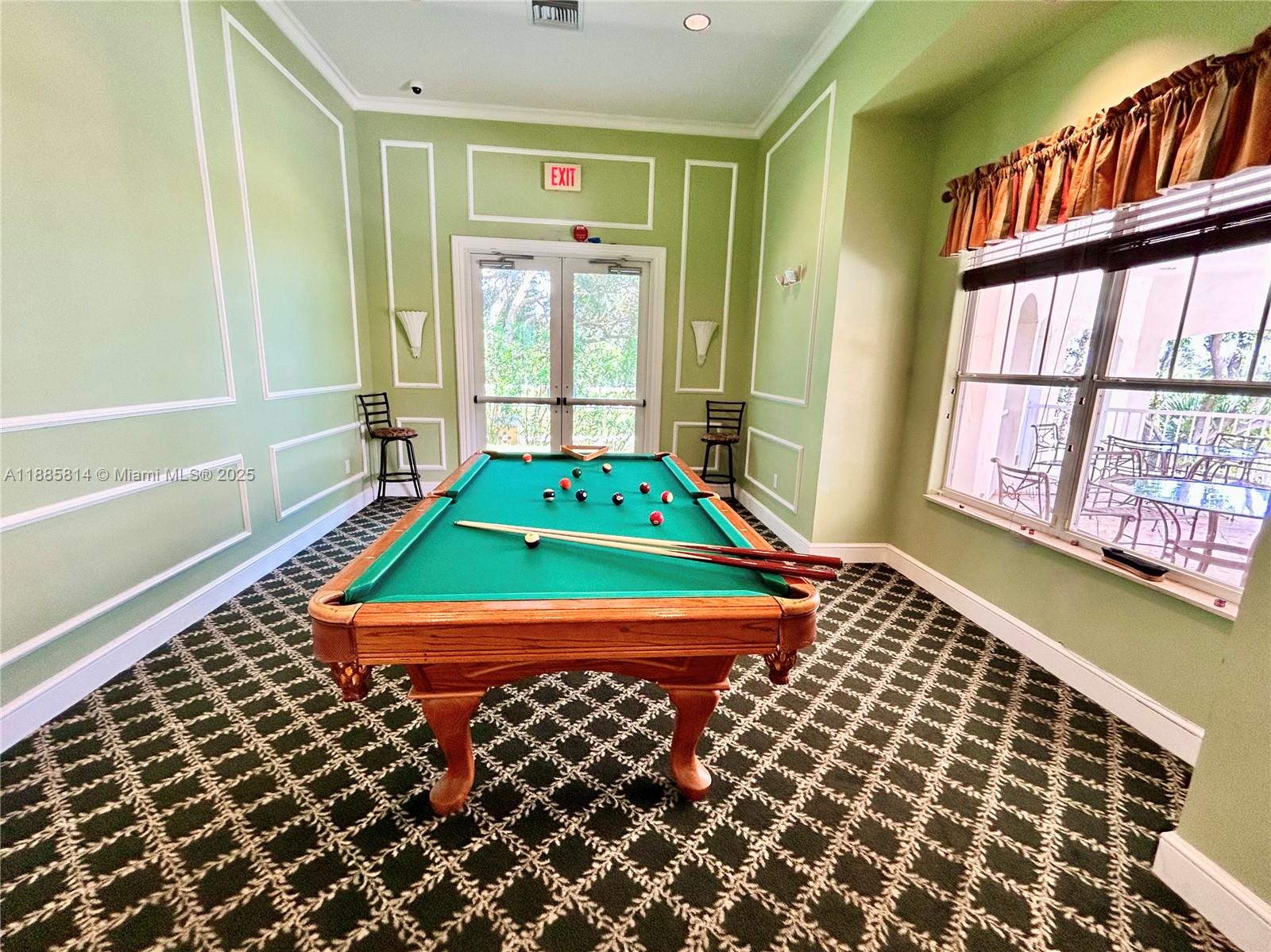 5080 Fairways Circle, Unit 307 Vero Beach, FL 32967 - Photo 24 of 27 a room with pool table and windows