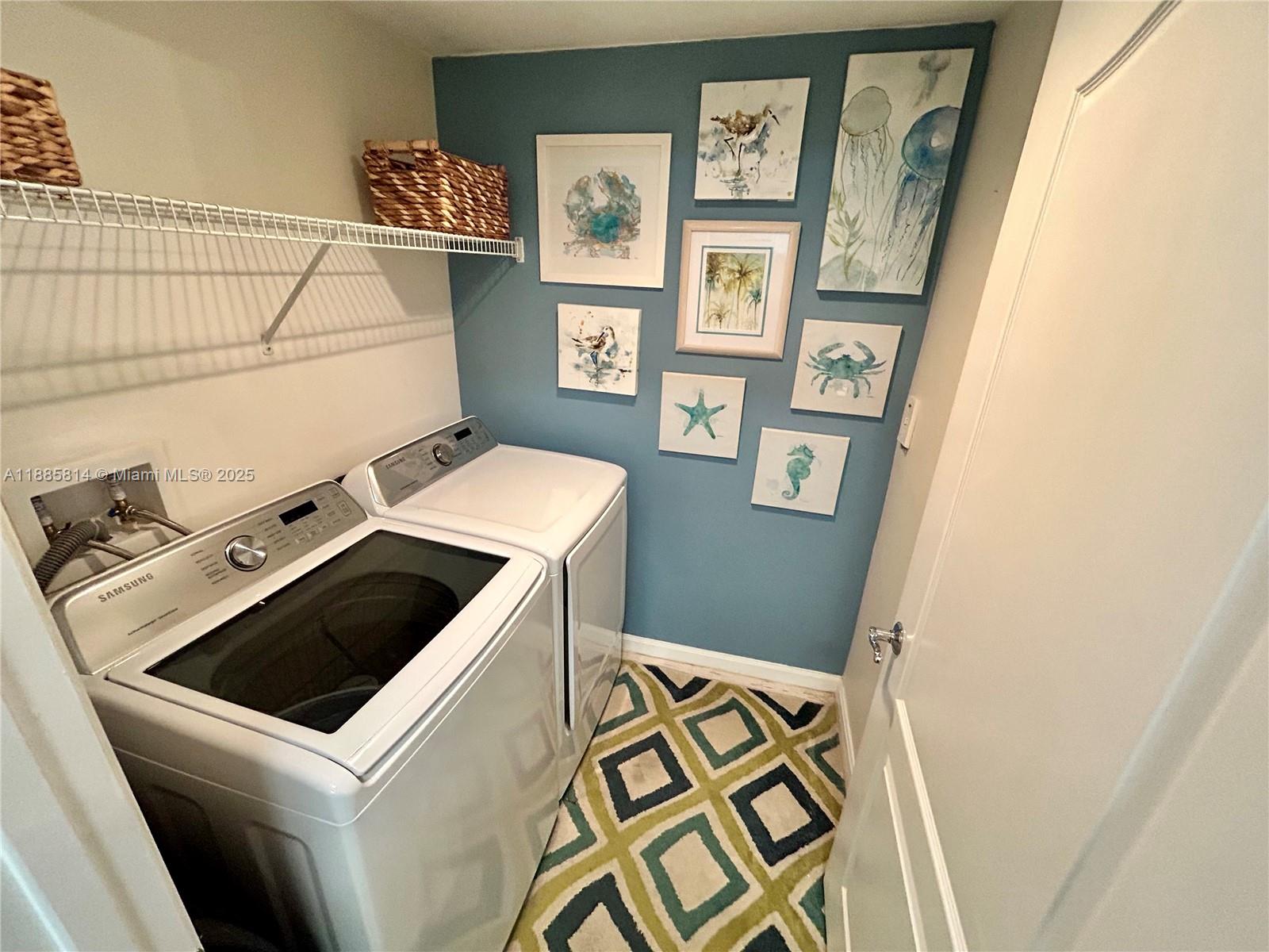 5080 Fairways Circle, Unit 307 Vero Beach, FL 32967 - Photo 6 of 27 a utility room with dryer and washer