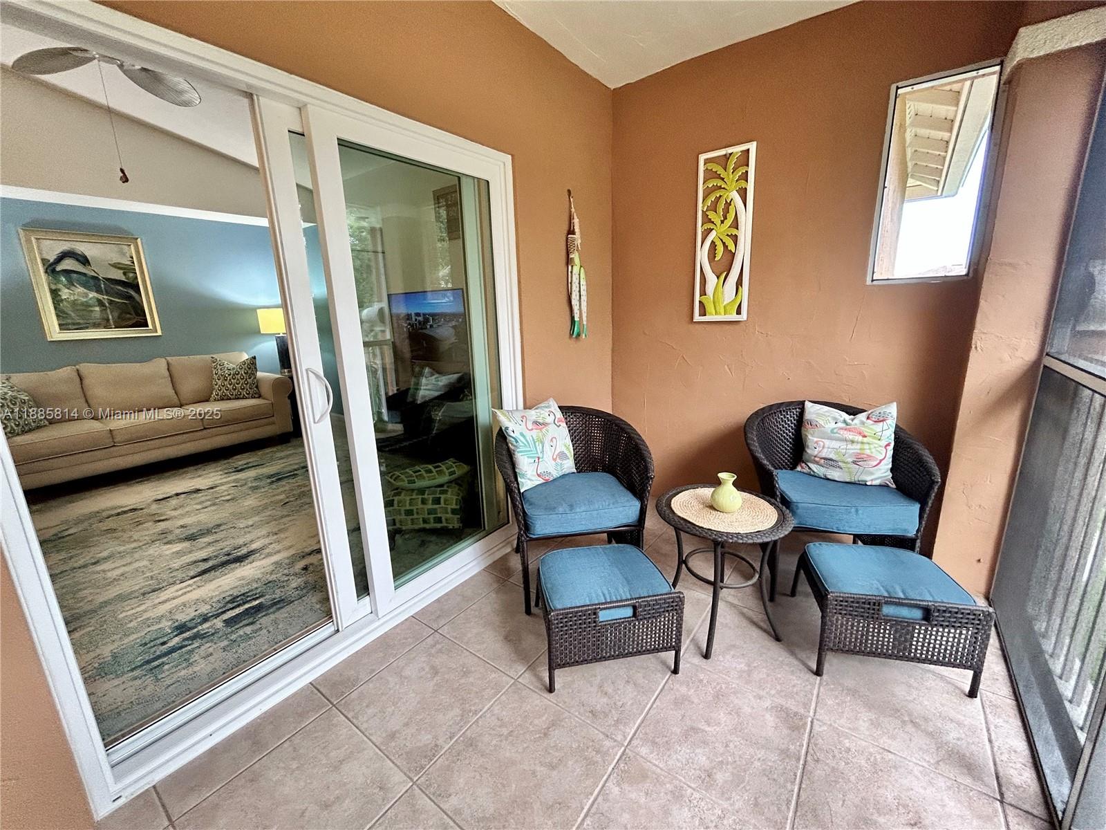 5080 Fairways Circle, Unit 307 Vero Beach, FL 32967 - Photo 10 of 27 a living room with furniture and a rug