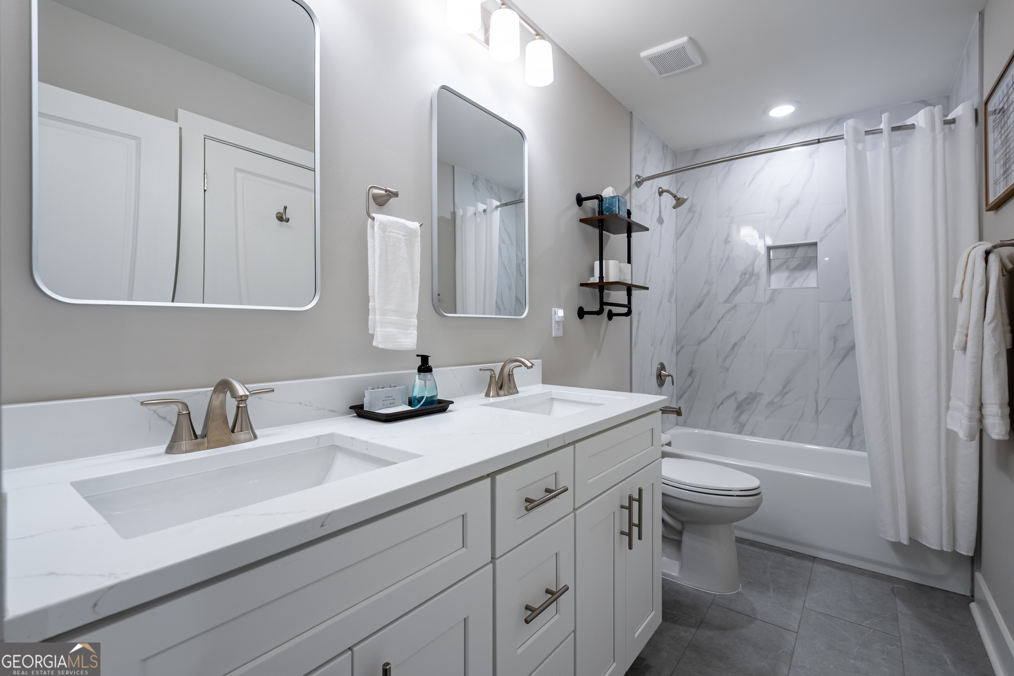 143 Old Alabama Road Southeast Emerson, GA 30137 - Photo 29 of 48 a bathroom with a double vanity sink toilet mirror and bathtub