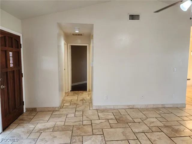 a view of an empty room and window