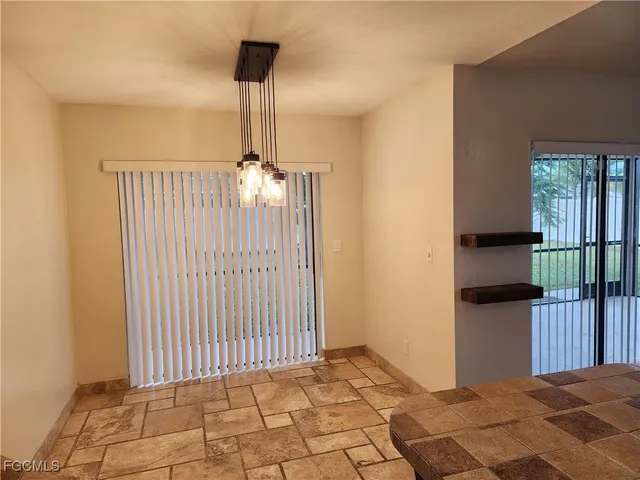 a view of a hallway with windows