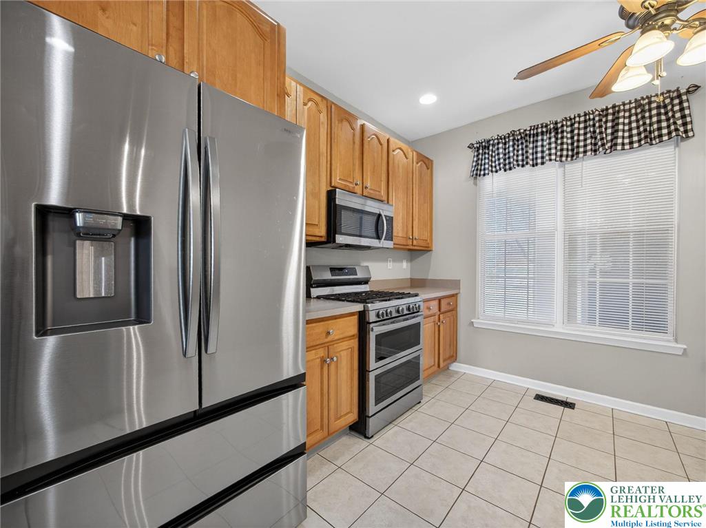 4312 Creek Road Allentown, PA 18104 - Photo 22 of 67 a kitchen with stainless steel appliances a refrigerator sink and microwave