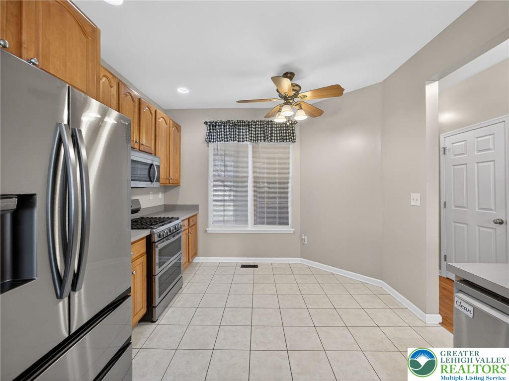 4312 Creek Road Allentown, PA 18104 - Photo 25 of 67 a kitchen with stainless steel appliances granite countertop a refrigerator a stove and a sink