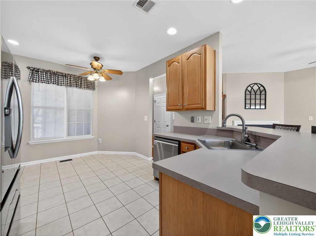 4312 Creek Road Allentown, PA 18104 - Photo 26 of 67 a view of a kitchen with a sink and a refrigerator