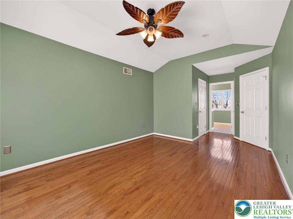 4312 Creek Road Allentown, PA 18104 - Photo 37 of 67 an empty room with wooden floor and windows