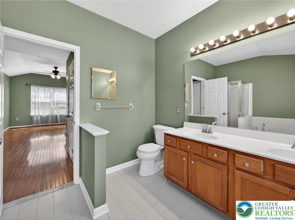 4312 Creek Road Allentown, PA 18104 - Photo 38 of 67 a spacious bathroom with a double vanity sink toilet and shower