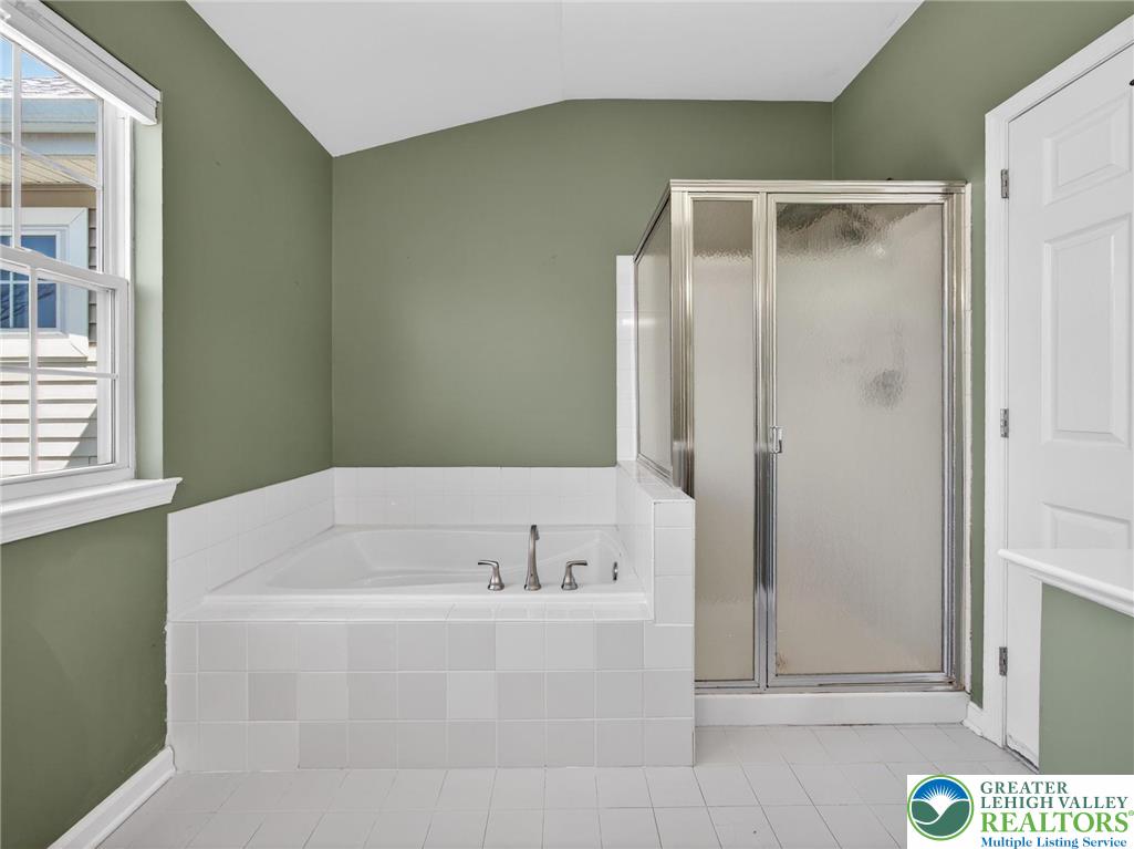 4312 Creek Road Allentown, PA 18104 - Photo 40 of 67 a bathroom with a bathtub and a shower