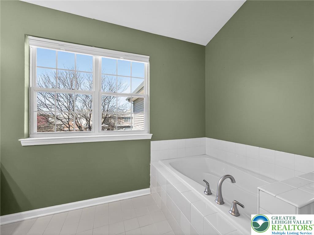 4312 Creek Road Allentown, PA 18104 - Photo 41 of 67 a bathroom with a bathtub and window