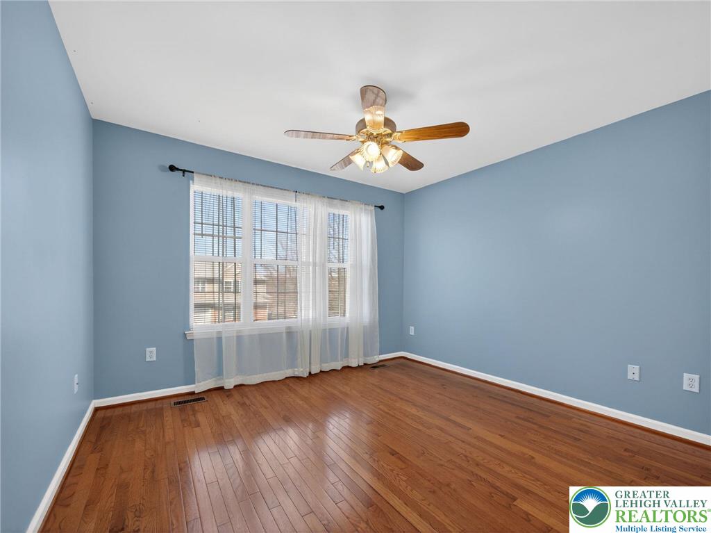 4312 Creek Road Allentown, PA 18104 - Photo 43 of 67 an empty room with a window and ceiling fan