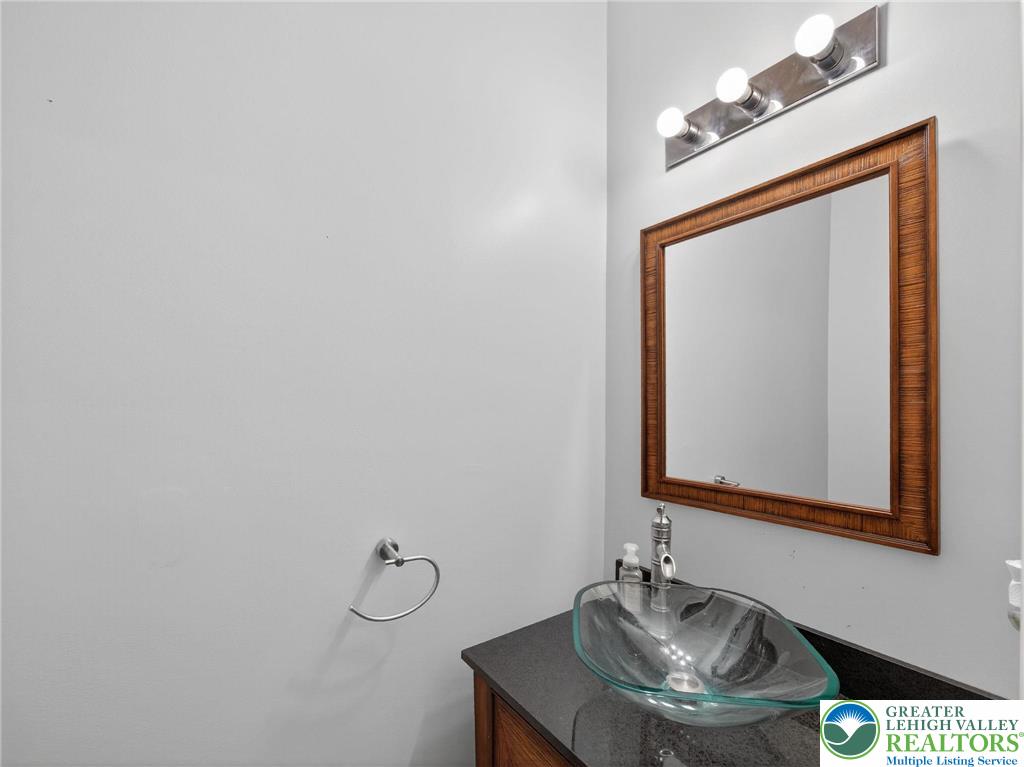 4312 Creek Road Allentown, PA 18104 - Photo 47 of 67 a bathroom with a granite countertop sink and a mirror