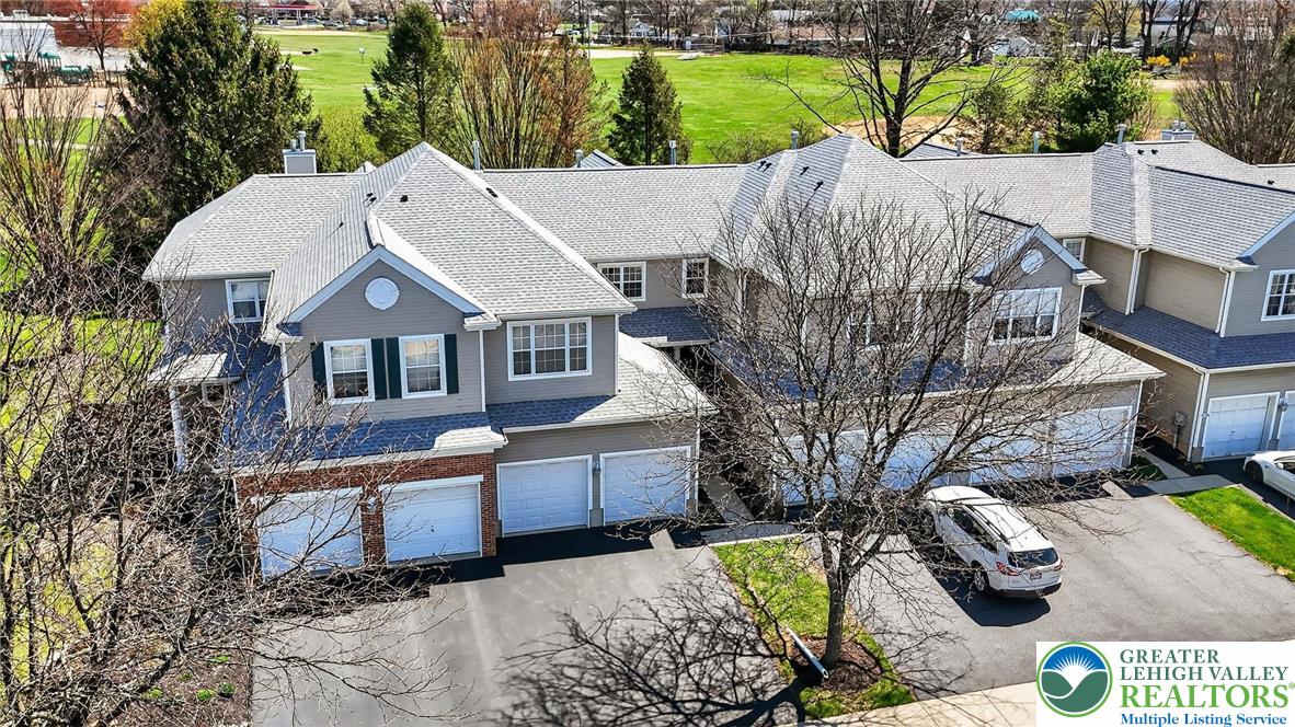 4312 Creek Road Allentown, PA 18104 - Photo 64 of 67 a aerial view of a house with large trees and lawn chairs