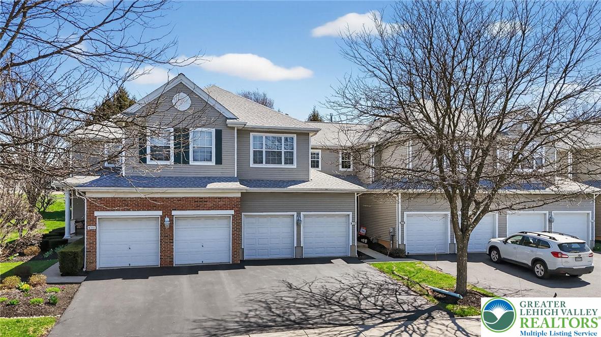 4312 Creek Road Allentown, PA 18104 - Photo 65 of 67 a front view of a house with a yard and garage